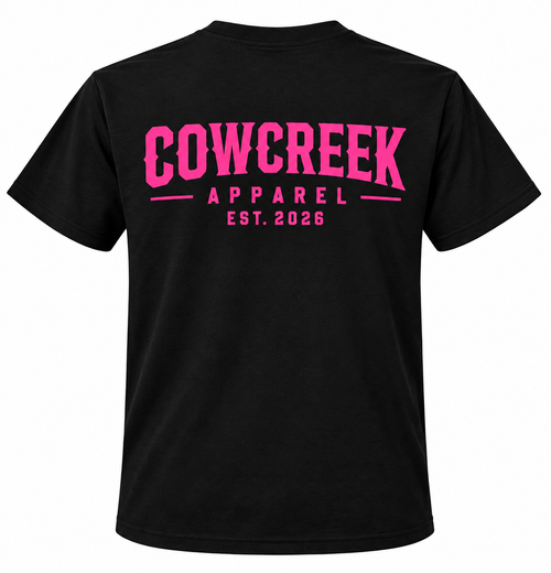 Cow Creek Apparel black Gildan t-shirt with hot pink EST. 2026 logo printed across the back