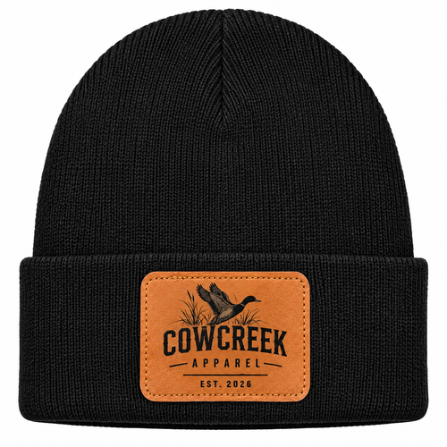 Black knit beanie with fold-over cuff and Cow Creek Apparel leather patch